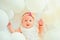 Waiting for a baby. Small girl. Happy birthday. Portrait of happy little child in white balloons. Sweet little baby. New