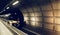Waiting in beautiful railway station tunnel stop no train at arriving Heathrow airport, London. Railroad with vintage toning for t