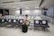 Waiting for flight at empty airport in Cyprus. Man sitting on chair with social distance marker at empty Paphos terminal