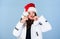 Waiting frosty christmas days. Girl wear white jacket and santa hat. Jacket has extra insulation to protect your body
