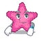 Waiting pink starfish animal on mascot sand