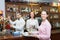 Waitress and barmen working