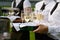 Waitress with dish of champagne glasses