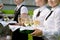 Waitress with dish of champagne glasses