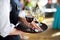 Waitress with dish of champagne and wine glasses