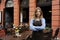 Waitress in front of restaurant