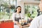 Waitress giving breakfast to customer