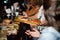 Waitress hands holding a big plate with sandwiches