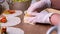 Waitress hands wrapping burrito filling in tortilla. 4k video