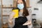 A waitress in a medical mask