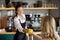 Waitress offering a cup of coffee