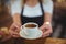 Waitress offering a cup of coffee