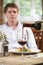 Waitress Pouring Customer Glass Of Red Wine