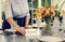 Waitress putting Table reserved card on table in a cafe