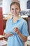 Waitress Ready To Take Order In Cafe