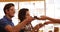 Waitress serving black tea to two friends