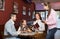 Waitress serving family of three