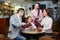 Waitress serving family of three