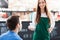 Waitress serving man coffee