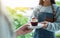 A waitress serving a piece of red velvet cupcake to customer