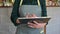 The waitress takes the order on the tablet in the cafe. The successful owner of a small cafe in a casual gray apron