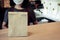 Waitress wearing protection face with dessert paper set bag on counter bar waiting for customer in modern cafe coffee shop, food d