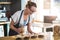 Waitress working at counter in cafÃ©