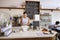 Waitress writing customerï¿½s order at counter of coffee shop