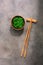 Wakame Chuka or seaweed salad with sesame seeds in bowl on dark brown rustic background. Traditional Japanese food. Top view, flat