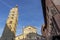 The wake of an airplane above the Duomo of Pistoia, Tuscany, Italy