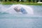Wake board rider sliding trick with water splash