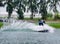 Wake boarding rider jumping trick with water splash.