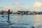 The wake of a charter fishing boat winds through channel markers.