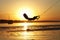Wakeboard, athlete silhouette on sunset background