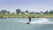 Wakeboarder is exerted on the lake to make figures