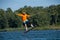 Wakeboarder jumps while training