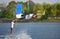 Wakeboarder man athlete performing wakeboarding jumps at cable wake park