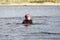 Wakeboarding. Girl wakeboarder fell into the water after an unsuccessful jump