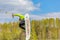 Wakeboarding. Teen Wakeboarder makes extreme Jump in air on wakeboard. Guy flies in the sky