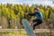 Wakeboarding. Teen Wakeboarder makes extremely difficult jump in air on wakeboard. Girl flies in the sky