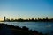 Wakesurfing on Danube river with sunset background and view on Vienna.