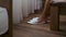 waking up in hotel room, woman is putting white slippers for guests, closeup view