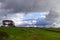 Wales : autumn. Rain showers and passing clouds over green fields.