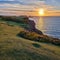 Wales Swansea, UK. Dragon\\\'s Rest: A Majestic Worm\\\'s Head Sunset in Wales