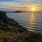 Wales Swansea, UK. Dragon\\\'s Rest: A Majestic Worm\\\'s Head Sunset in Wales