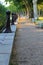 A walk along the embankment, rows of benches for relaxation, a warm summer evening.