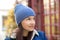 Walk around the city in cold weather. Woman in a blue hat. Concept lifestyle, autumn