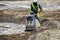 Walk behind vibrating machine is compacting soil