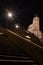 Walk through the city at night on the monumental stairs, towards the bell tower