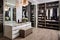A walk-in closet with custom shelving, shoe racks, and a vanity area for getting ready in style.